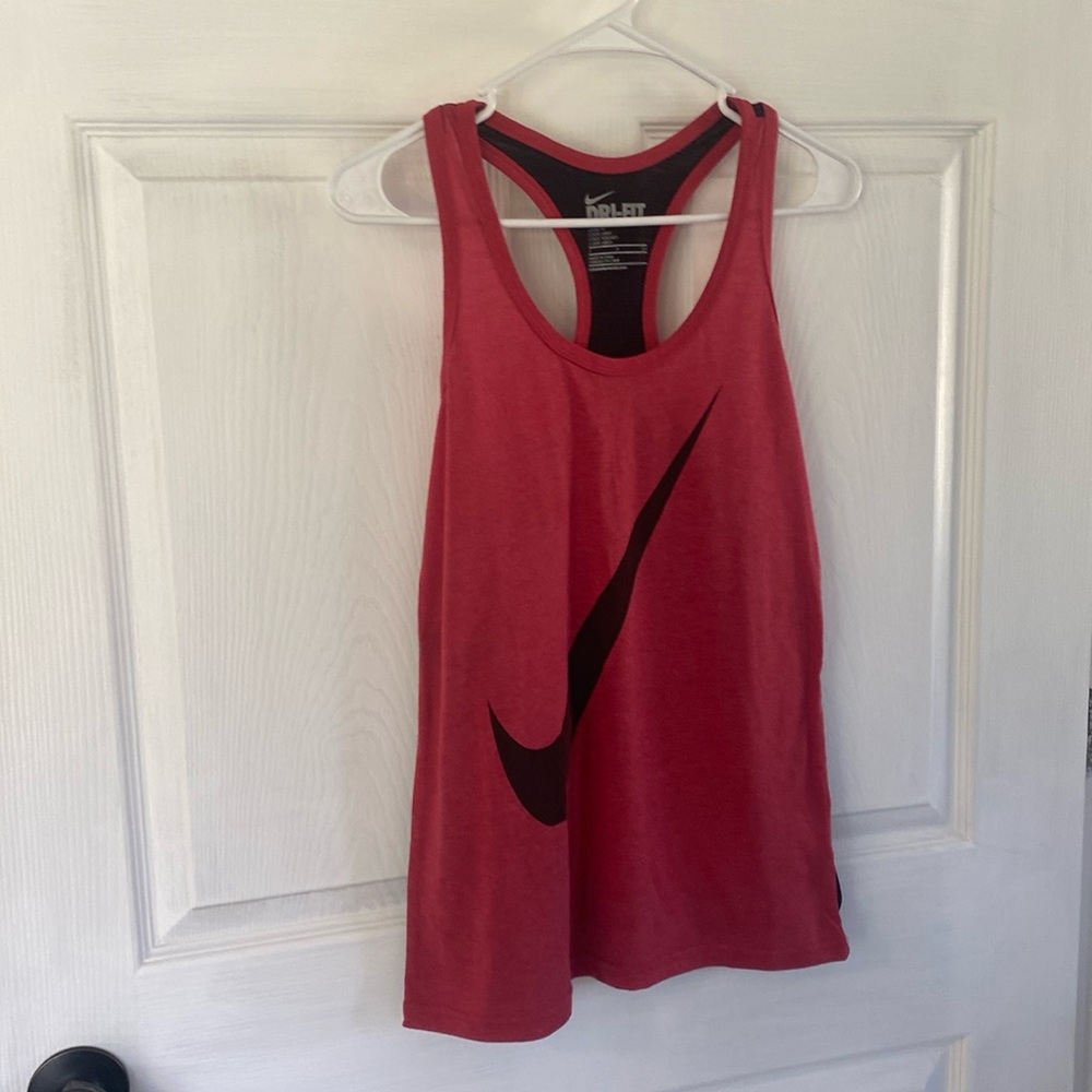 Nike Dri-Fit  Loose fit. Size S. Coral and black. Large Nike sign in front
